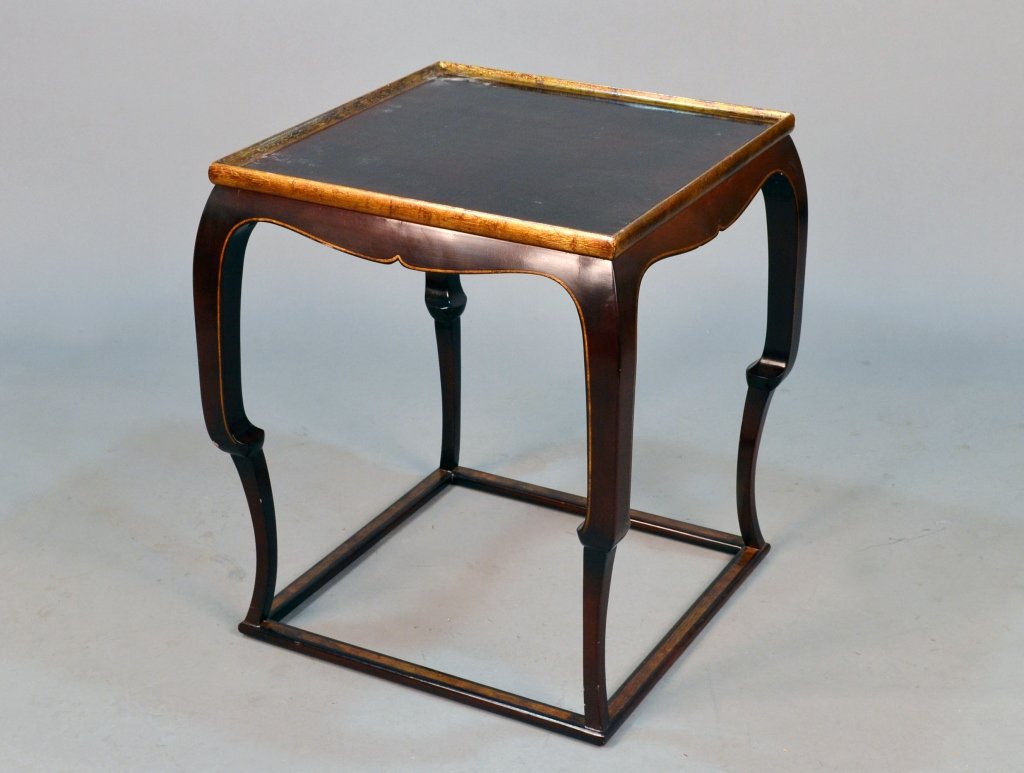 Asian Style Lacquered Table: Square top with gilt edge on Asian style legs joined by a box stretcher. Height 27 1/2 inches, 24 inches square.