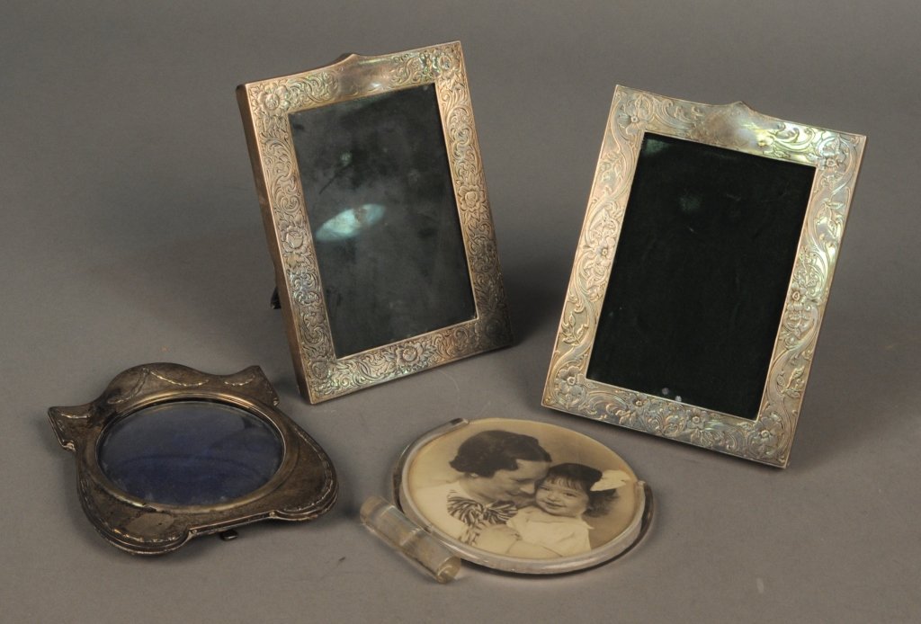 Three Sterling Silver Picture Frames: Including a pair by Lebkuecher & Co.; together wtih an modern acrylic picture frame. Pair, fits 4x6 photo. Provenance: From a Gramercy Park estate.