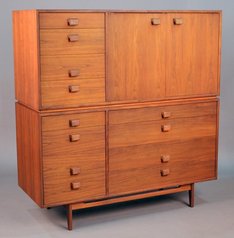 Jens Risom Teak Two Part Cabinet: Rectangular top over a two door cabinet flanked on one side by a bank of four drawer, the lower section with two banks of four drawers, tapered legs. Height 31 3/4 inches, width 54 inches, depth 21 in