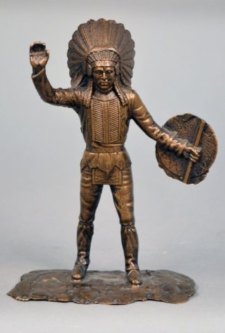Tiffany Studios Bronze Indian: Modelled standing with right arm raised, signed on the base. Height 6 inches.