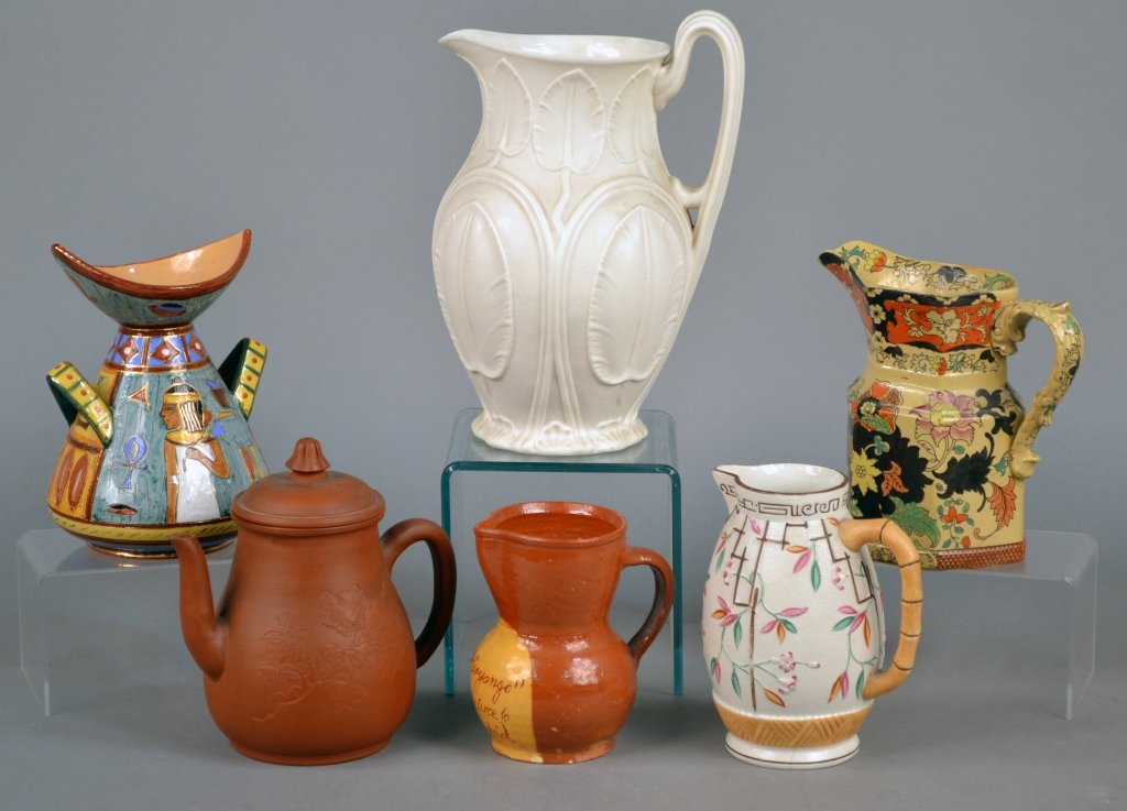 Group of English and Continental Jugs: Including an English biscuit pitcher and a Mason's Bandana Ware jug; together with an Italian Deruta vase, a Spanish jug, etc. Biscuit pitcher, height 11 inches. Provenance: From a Gramercy Park estat