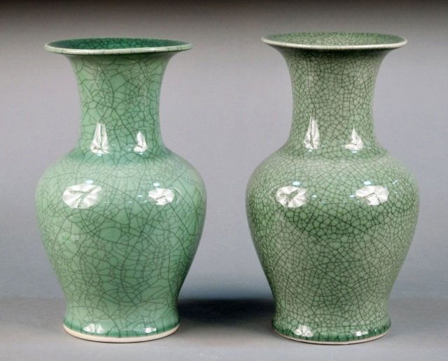 Pair of Glazed Porcelain Vases: Each green crackle glazed with inverted baluster form body with waisted neck, flared rim and a slightly spread foot. Height 14 inches.