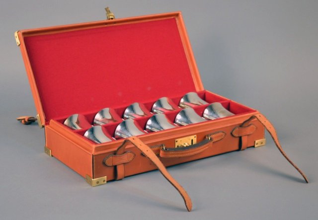 Set of Ten English Beakers: London, maker's mark of Theo Fennel, gilt interiors, in original leather storage case. Total 55 ounces.