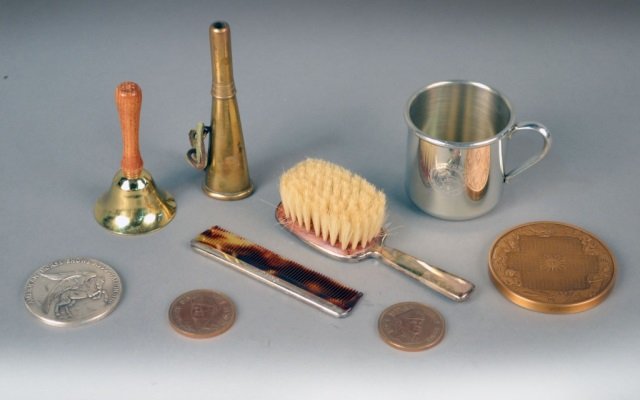 Cartier Sterling Silver Baby Brush and Comb: Genuine horse hair brush. length 5 1/2 inches; together with a baby cup, bell, and three medallions, etc.