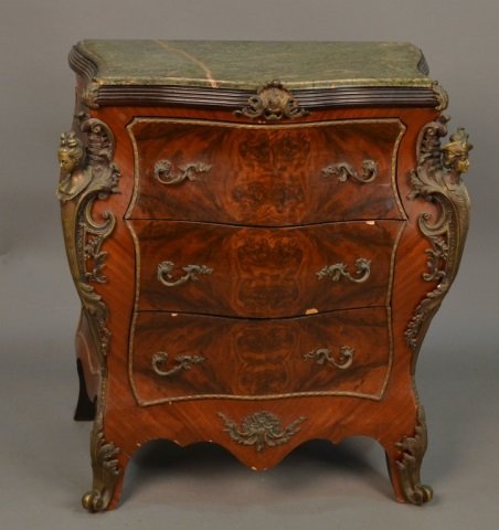 Louis XV Style Marble Top Commode: Green mottled marble serpentine top over three bombe drawers flanked by a male and female term, scroll sabot feet. Height 38 inches, width 32 inches, depth 22 inches.