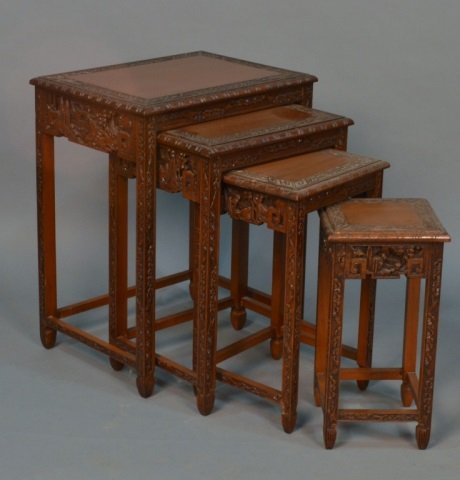 Asian Nest of Tables: Rectangular top with craved stylized floral border. Largest, height 25 1/2 inches, width 20 inches, depth 15 inches.