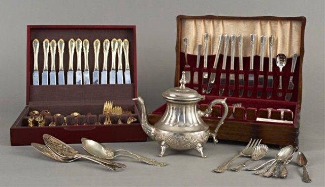 Group of Silver Plated Flatware: Including two flatware partial sets in storage boxes, assorted silver plated flatware serving pieces and a teapot. Teapot, height 10 inches.