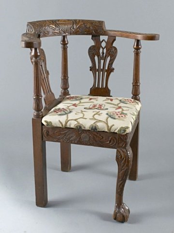 George III Style Walnut Corner Chair: Late 19th - early 20th century, of typical form. Height 33 inches, width 27 1/2 inches, depth 25 inches. Note: Being sold to benefit Fordham University, -received by the university upon the sale of In