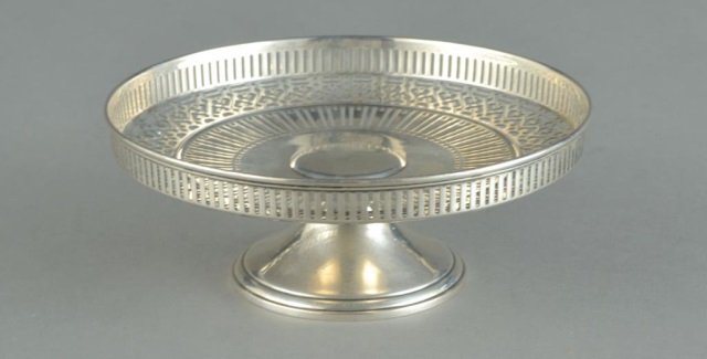 Tiffany & Co. Sterling Silver Cake Stand: Circular bowl with pierced decoration on a pedestal base. Monogrammed. Diameter 7 1/2 inches, 9 ounces. Provenance: Descended in the family of Charles H. Ebbets, builder of Ebbet's Field in Brooklyn t