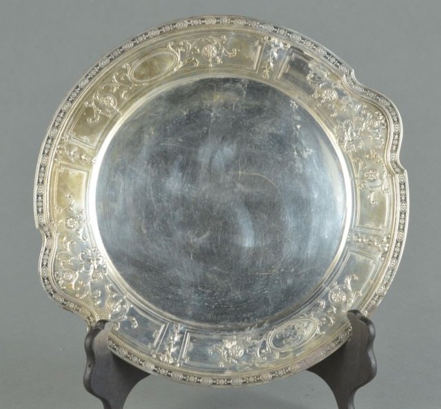 Theodore Starr Sterling Silver Circular Tray: Circular, with flower and scroll decoration. Monogrammed. Diameter 11 3/4 inches, 20 ounces. Provenance: Descended in the family of Charles H. Ebbets, builder of Ebbet's Field in Brooklyn to the prese