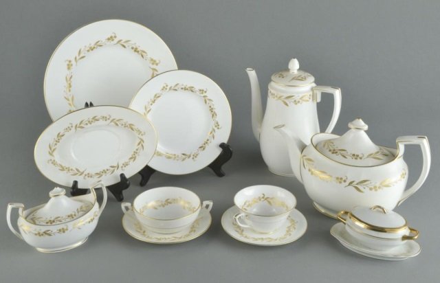 Royal Worcester Porcelain Dinner Service: Saguenay pattern, comprising eleven dinner plates, eleven salad plates, ten soup cups, with under plates, ten bread and butter plates, seven cups, nine saucers, coffee pot, teapot, covered sugar and a