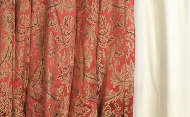 Group of Red Damask Window Treatments: Ten lined panels. Length top to bottom 89 inches, width top 48 inches, width bottom 82 inches.