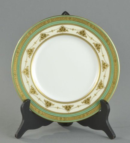 Set of Sixteen Mintons Dessert Plates: Apple green border with raised gilt highlights. Diameter 9 inches. Provenance: Descended in the family of Charles H. Ebbets, builder of Ebbet's Field in Brooklyn to the present owner.