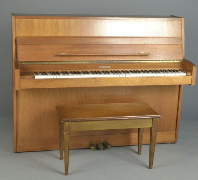 Baldwin Spinet Piano: Blond wood case. Height 45 inches, width 57 inches, depth 23 inches.