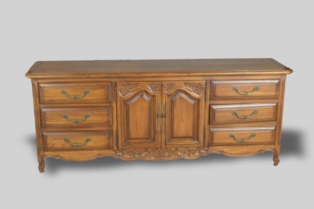 Fruitwood Credenza: Rectangular top over two central doors flanked by two banks of three drawers. Height 32 inches, width 6 feet 8 inches, depth 20 inches.