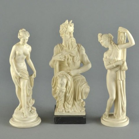 Three Simulated Ivory Figures: Moses and two classical females. Moses, height 9 1/2 inches.