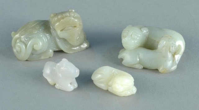 Four Chinese Carved Hardstone Figures: Two entwined dogs, a ram, a foo lion and another dog. Largest, length 2 1/4 inches.