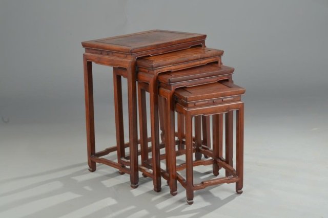 Asian Hardwood Nest of Tables: Set of four tables. Each with carved apron. Largest table height 26 inches, width 20 inches, depth 14 inches.