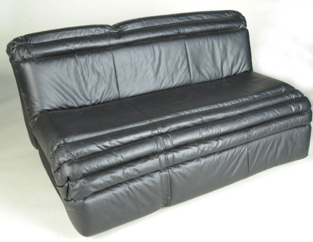 Black Leather Sofa: Armless black leather upholstered convertible sofa. Height 30 inches, width 60 inches, depth 39 inches.