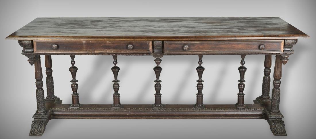 Walnut Library Table: Rectangular top with molded edge over two drawers, on a central row of turned supports. Height 30 1/2 inches, length 6 feet 10 inches, width 29 inches. Provenance: From a Riverdale Estate