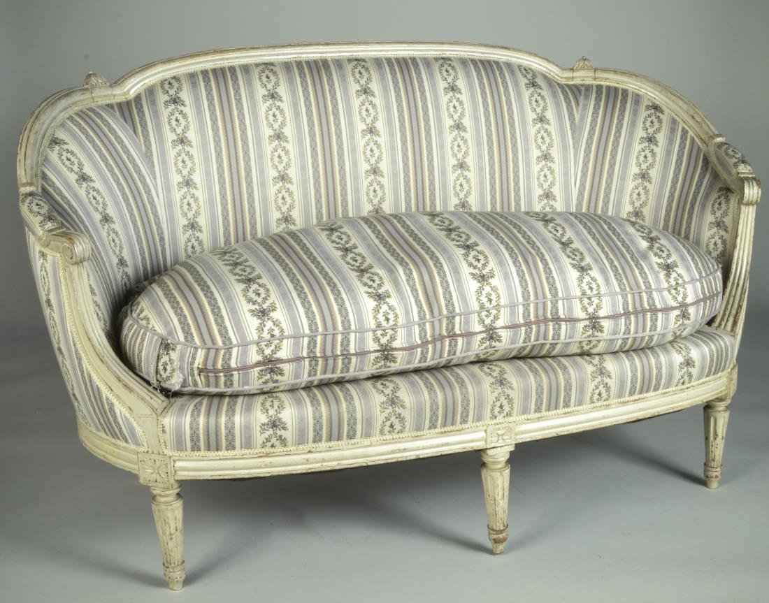 Louis XVI Style Painted Canape a Corbeille: Cream painted with striped upholstery, scrolled arms, fluted tapered legs. Height 36 inches, length 60 inches, depth 30 inches.