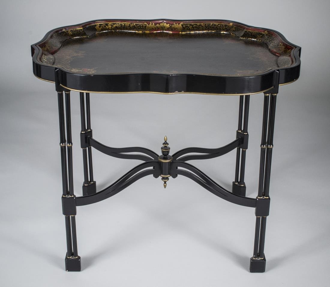 Papier-Mâché Tray Table: Shaped rectangular top with gilt decoration, on a faux bamboo base. Height 26 1/4 inches, width 32 1/2 inches, depth 25 inches.