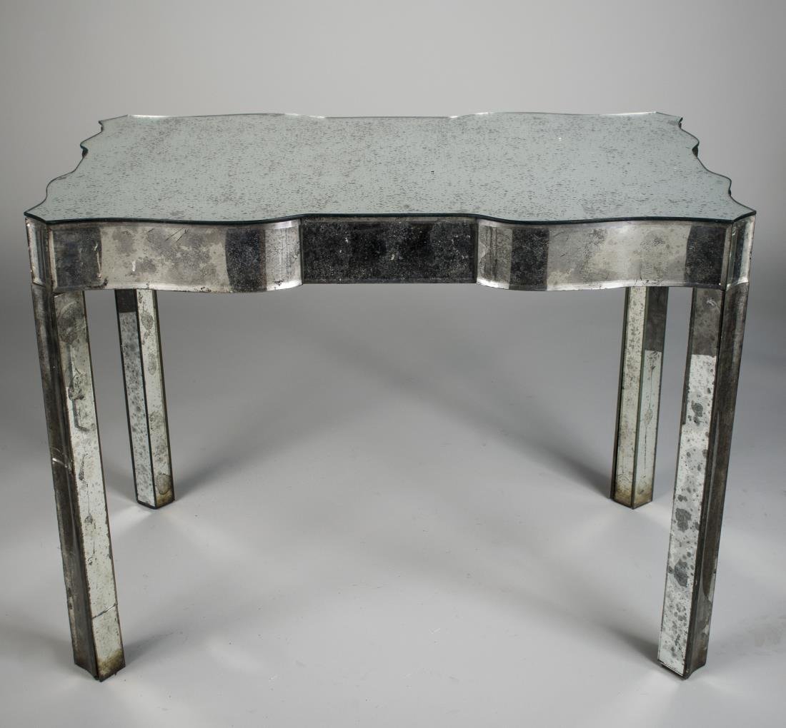 Art Deco Mirrored Table: Shaped rectangular top on square legs. Height 30 1/4 inches, width 40 inches, depth 25 inches.