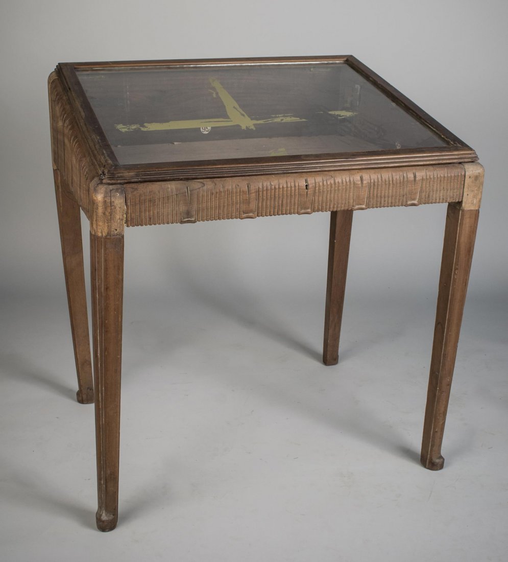 Attr. Jacques Ruhlmann Vitrine Table: Rectangular glazed panel lift top, square tapered legs. Height 43 inches, width 39 inches, depth 32 inches.