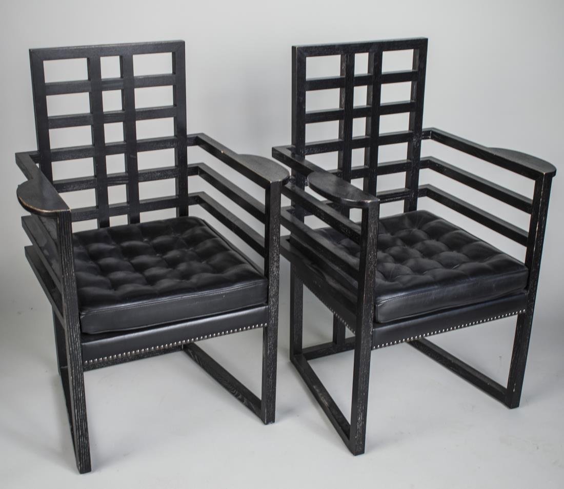 Pair of Josef Hoffman Style Chairs: Black painted armchairs with open backs and arms. Height 38 inches, width 26 inches, depth 20 inches.