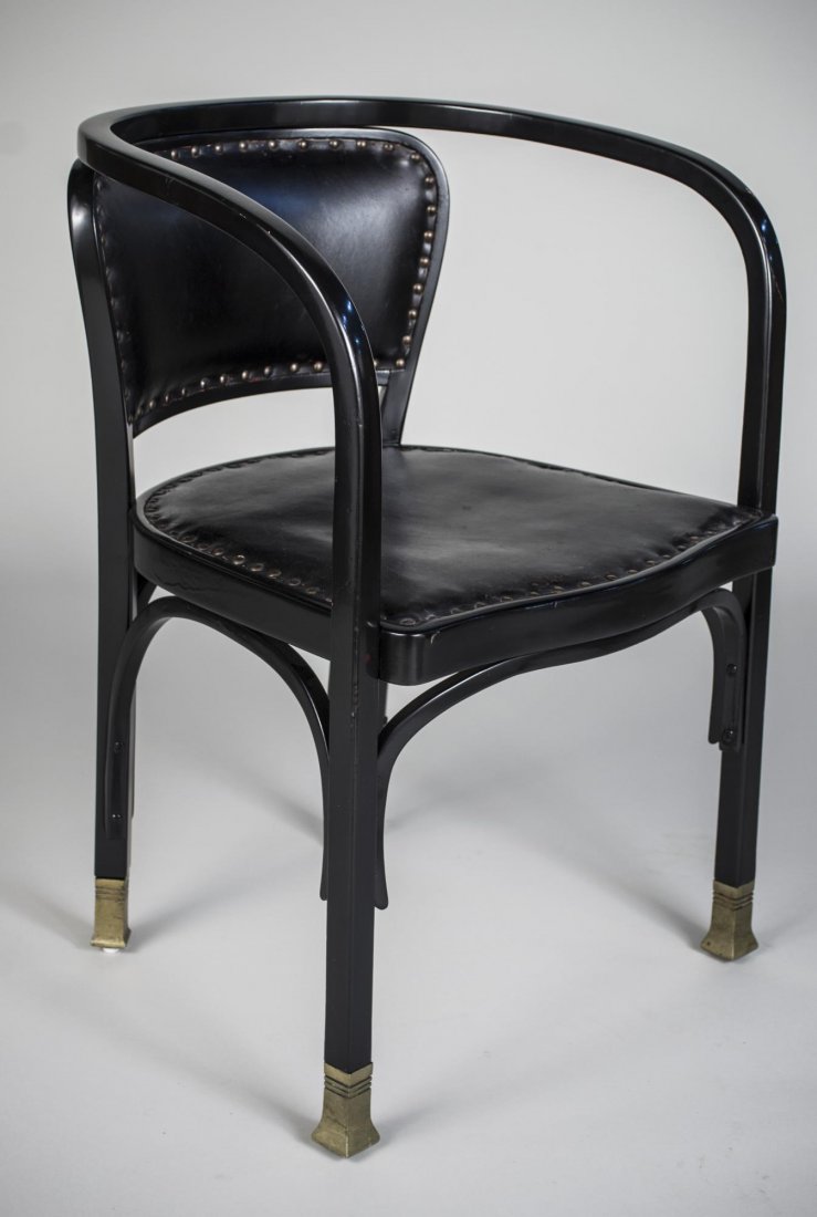 Koloman Moser Black Armchair: Label on stretcher, upholstered back and seat, open bentwood arms, brass capped feet. Height 30 1/4 inches, width 21 inches, depth 21 inches.