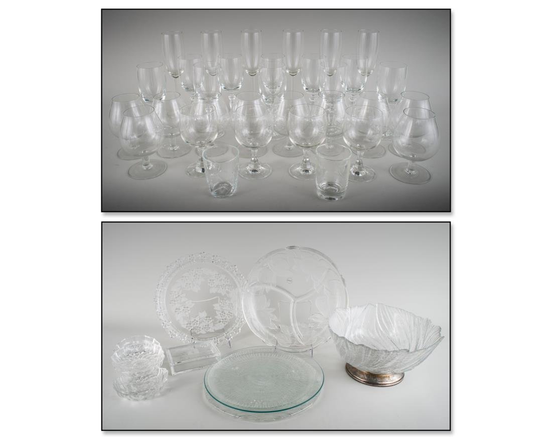 Group of Glass Table Articles: Including five circular trays, center bowl, set of six dessert bowls, rectangular covered box. Center bowl, height 6 1/2 inches, diameter 12 1/2 inches; together with approximately 30 pieces of stemwa