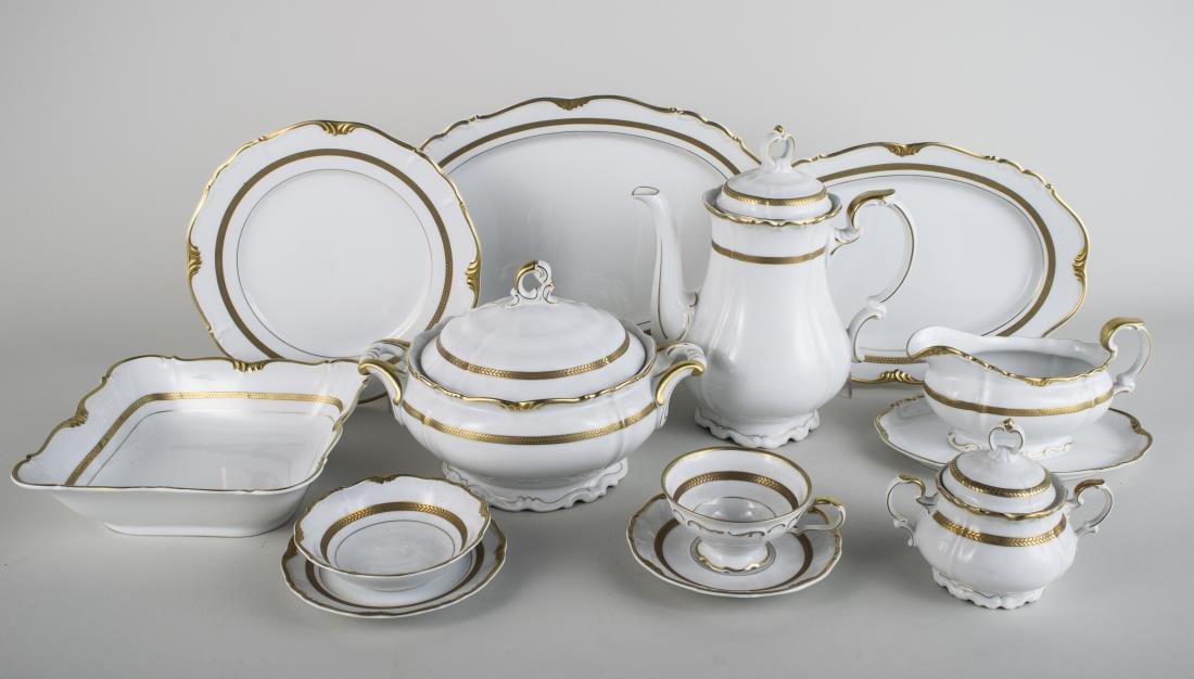 Bavarian Porcelain Dinner Service: Maria Theresia pattern, comprising eleven dinne plates, twelve salad plates, twelve bread plates, twelve soup bowls, twelve fruit bowls, twelve saucers, twelve cups, two oval platters, a sauceboat, a 