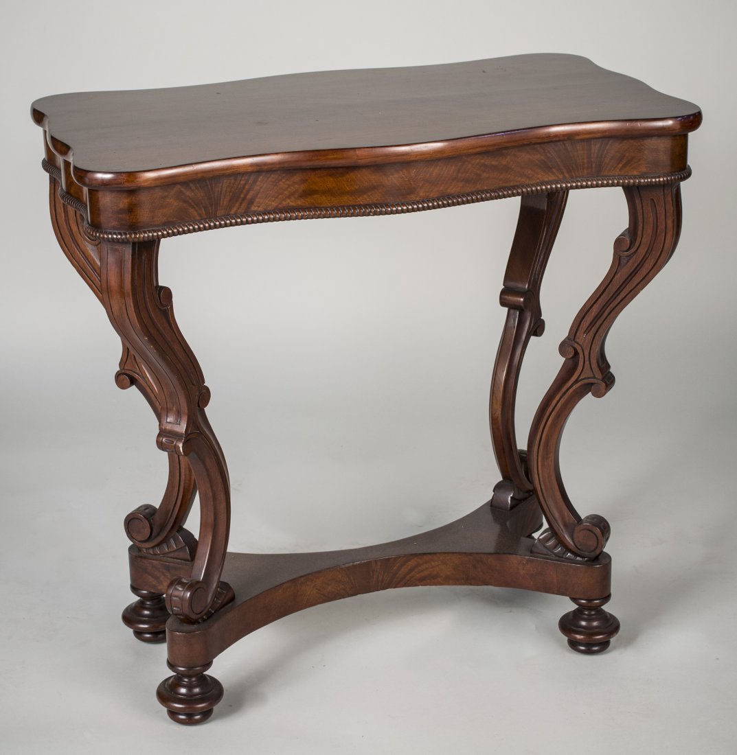 American Mahogany Serpentine Table Circa 1840s: Possibly Meeks, shaped rectangular top over a conforming apron, on double scroll legs joined by a modified stretcher. Height 28 1/2 inches. width 29 inches, depth 17 inches
