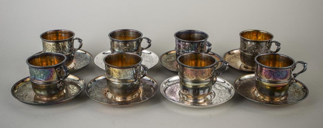 Set of Eight Christofle Cups and Saucers: Scroll decoration, gilt interior. Cup, height 2 1/2 inches
