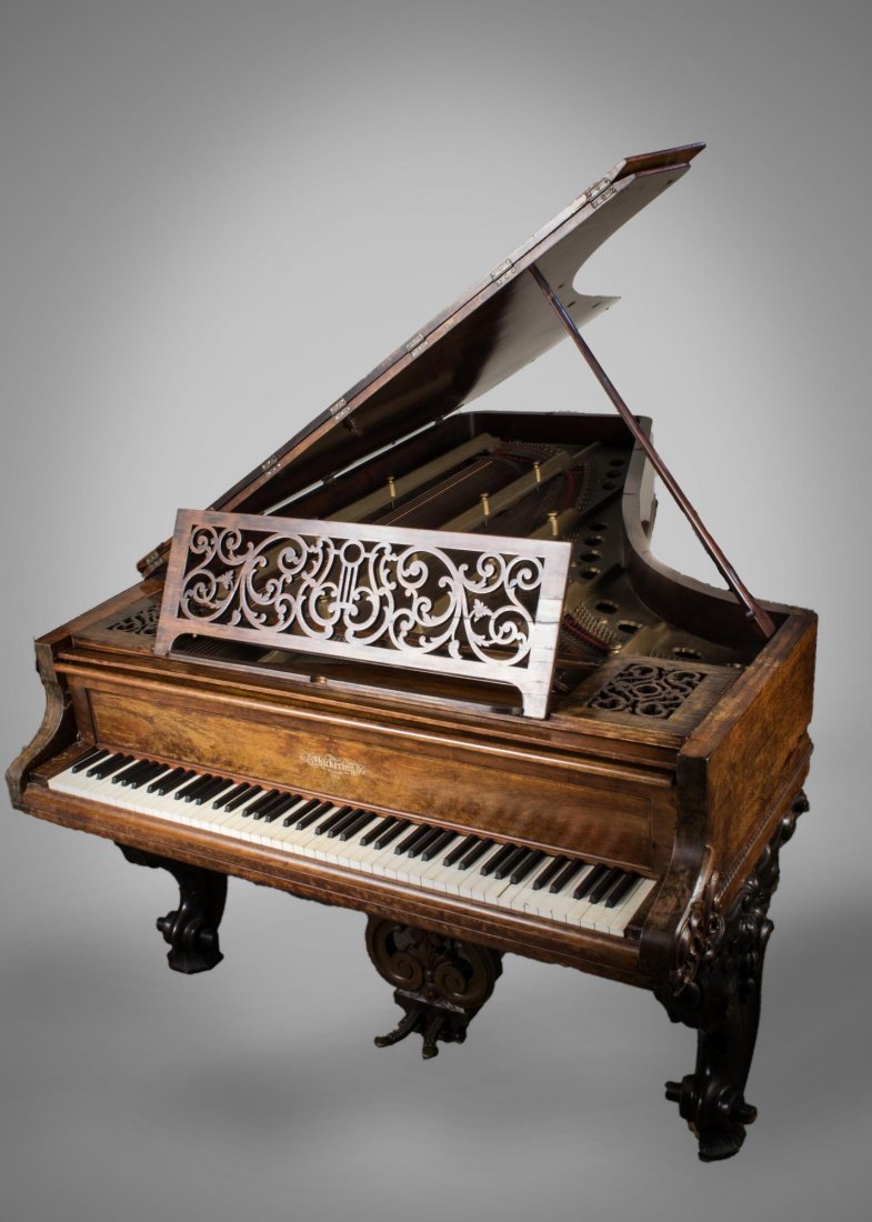 Chickering Parlour Grand Piano: Walnut case. Length 7 feet 6 inches.