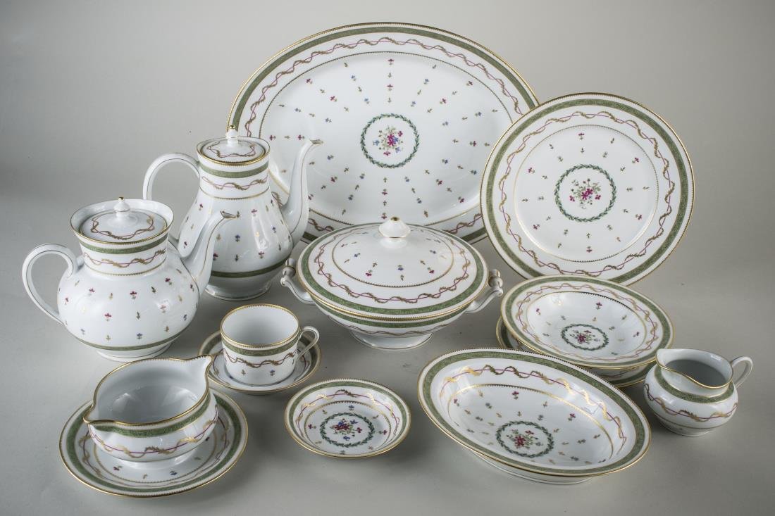 Haviland Porcelain Dinner Service: Vieux Paris - Green pattern, comprising nine dinner plates, nine salad plates, six bread plates, eleven cups and saucers, twelve fruit bowls, six serving dishes. Dinner plate diameter 10 1/4 inches.