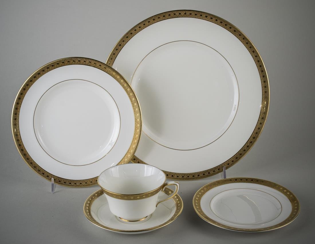Royal Worcester Porcelain Dinner Service: Pattern C2332, comprising twelve dinner plates, twelve salad plates, eleven bread plates, eleven cups and saucers. Dinner plate diameter 10 3/4 inches.