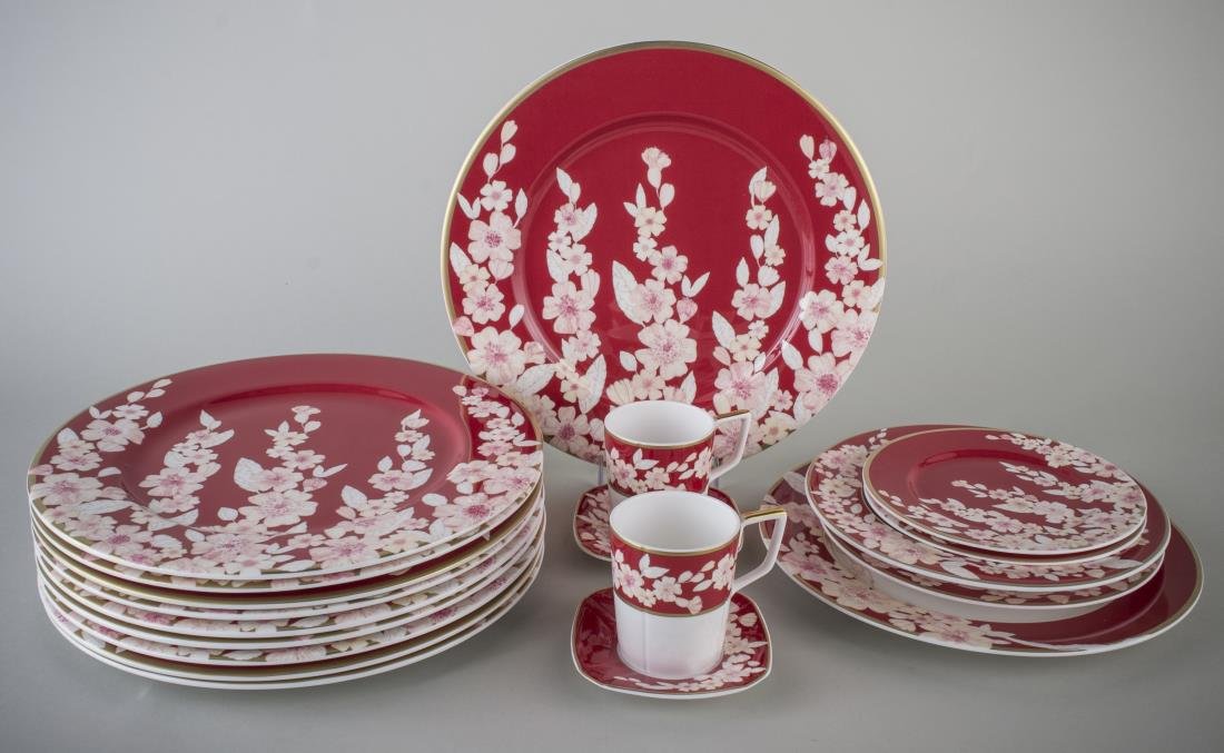 Valentino Porcelain Partial Dinner Service: Approximately nineteen pieces, Spring pattern, comprising ten chargers, one dinner plate, one salad plate, one bowl, two bread plates, two cups, and two saucers. Dinner plate diameter 10 3/4 inches.