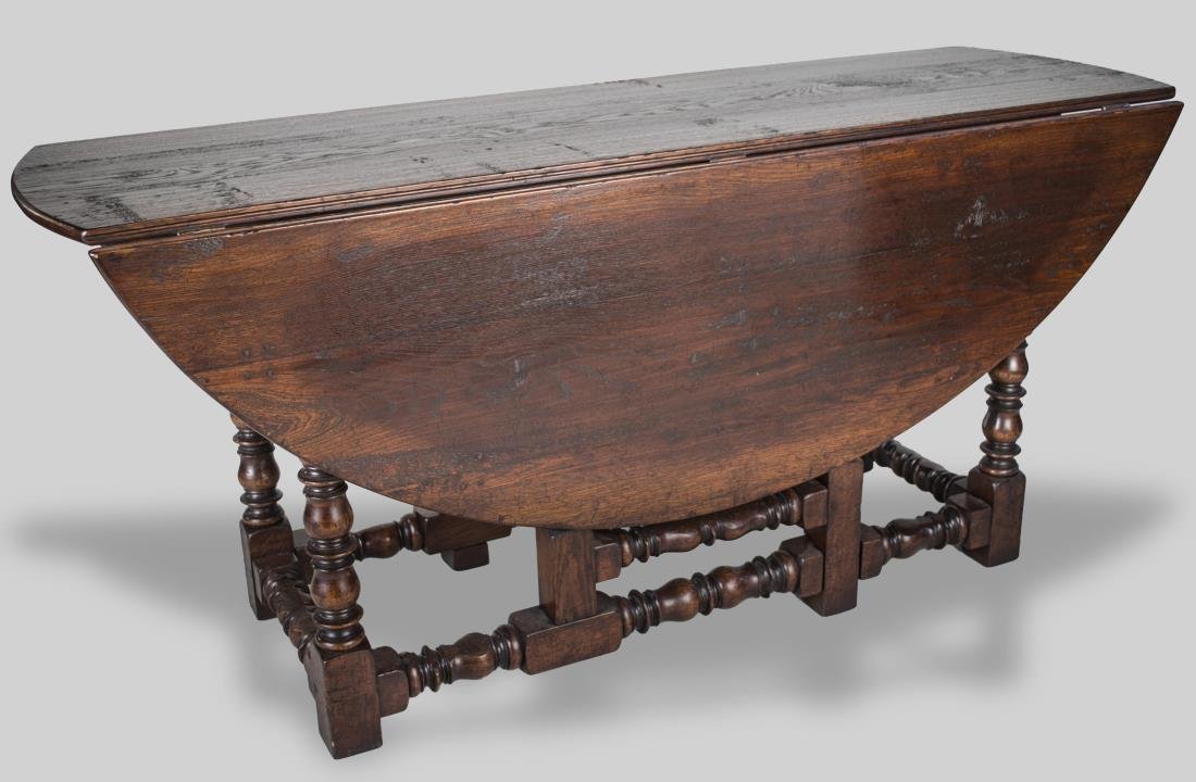 Drop Leaf Gate Leg Wake Table: D shaped drop leaves on turned legs joined by a shaped box stretcher. Height 30 inches, width 5 feet 6 inches, depth 5 feet 9 inches