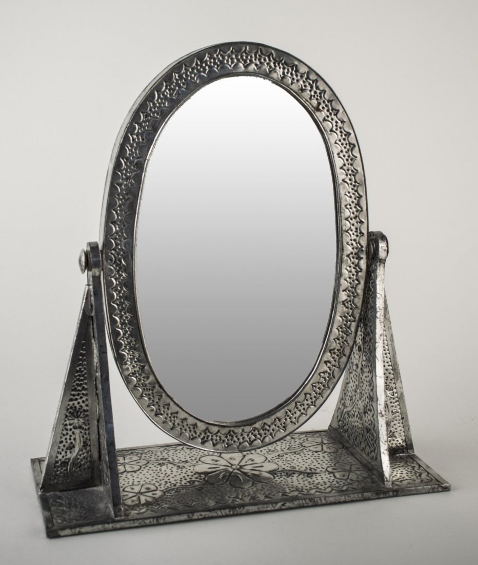 Metal Easel Mirror: Oval mirror on a stand, Height 16 inches.