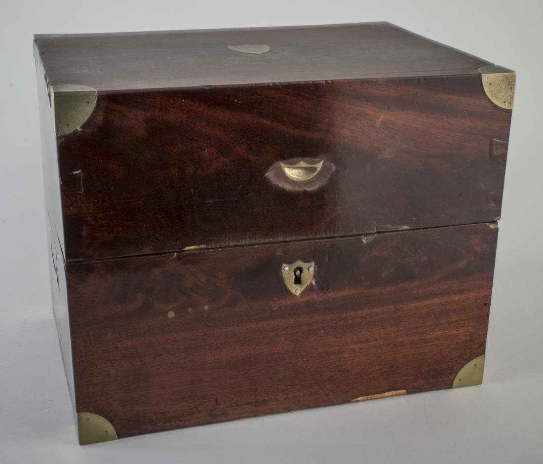 Victorian Brass Bound Mahogany Box: 19th century, rectangular box with brass corners and top escutcheon. Height 9 inches, width 11 3/4 inches, depth 8 1/2 inches.