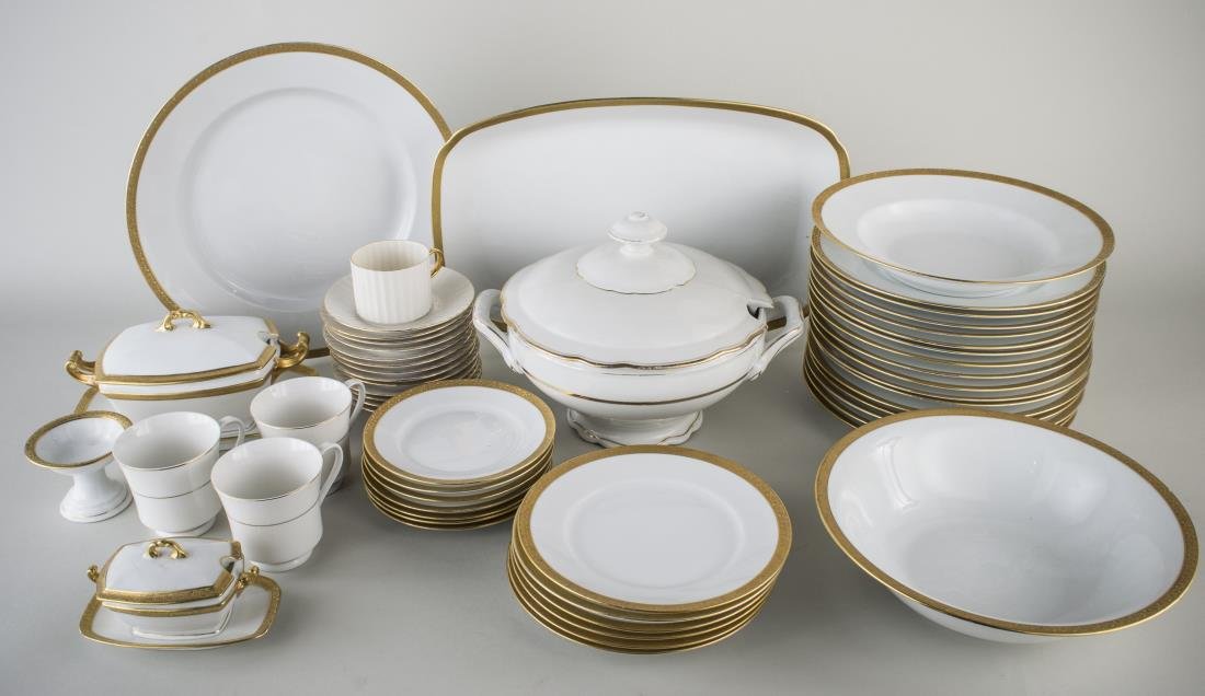 Czechoslovakian Assembled Porcelain Dinner Service: Approximately ninety three pieces, white with gold rim, comprising eighteen dinner plates, twelve salad plates, twelve bread plates, eleven bowls, twenty one cups, fourteen saucers, a covered serving 