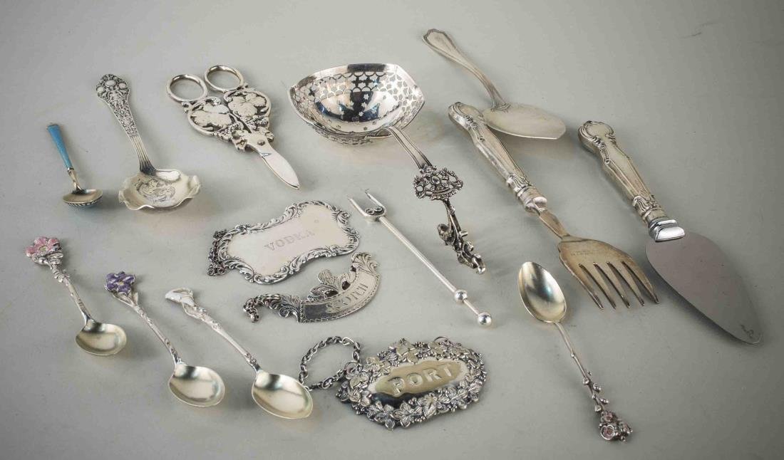 Group of Sterling Silver Flatware Articles: Various makers and patterns, including enamel coffee spoons, cheese knife, pierced server, sterling grape shears, three decanter labels, etc. Total 180 grams, weighable.