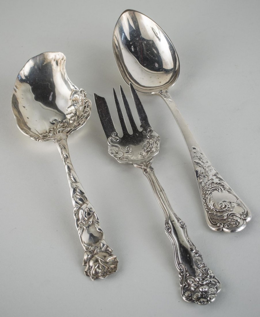Three American Sterling Silver Serving Articles: Various makers and patterns, comprising two spoons and a fork. Total 330 grams.