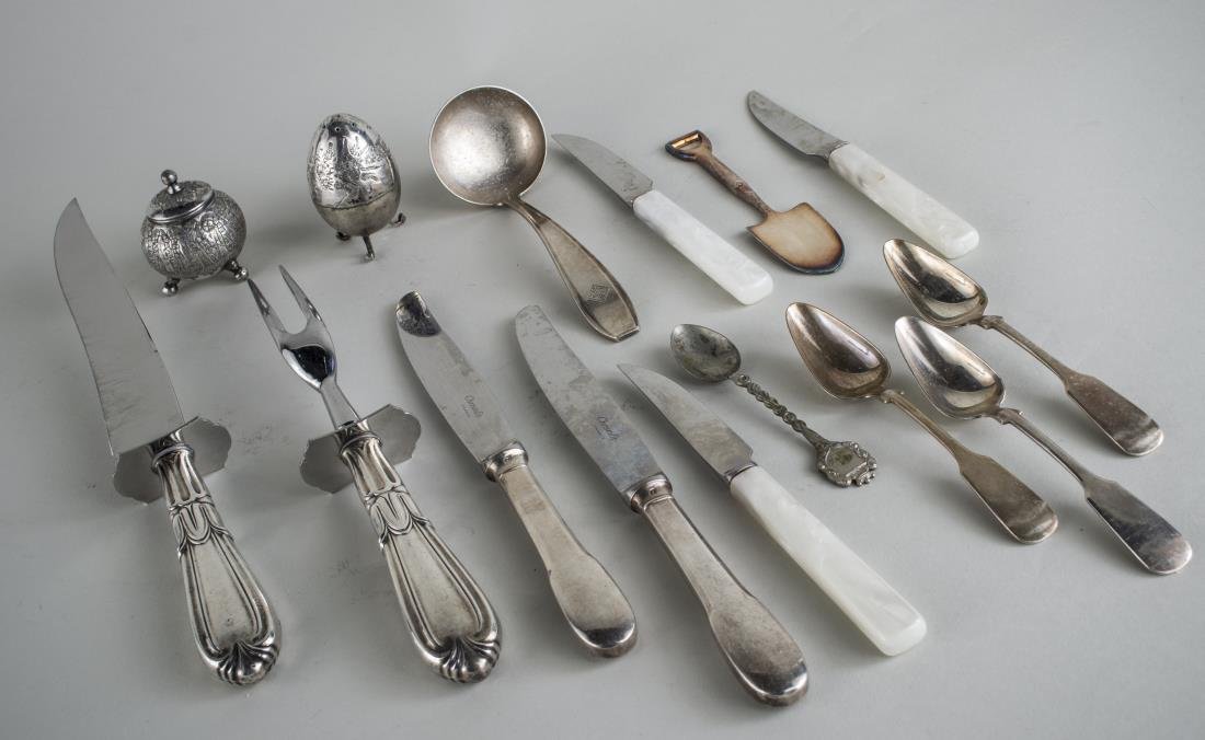 Group of Sterling and Silver Plated Flatware: Including a two piece carving set, two Christofle silver plated dinner knives, ladle, set of four simulated mother of pearl fruit knives, four sterling silver teaspoons, souvenir spoons, set of four E