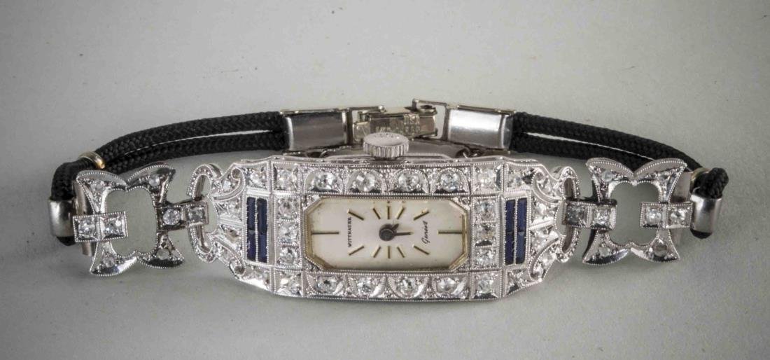 Wittnauer Art Deco Diamond Watch: 15 jewel movement in a platinum case with 44 round diamond, black cord band.