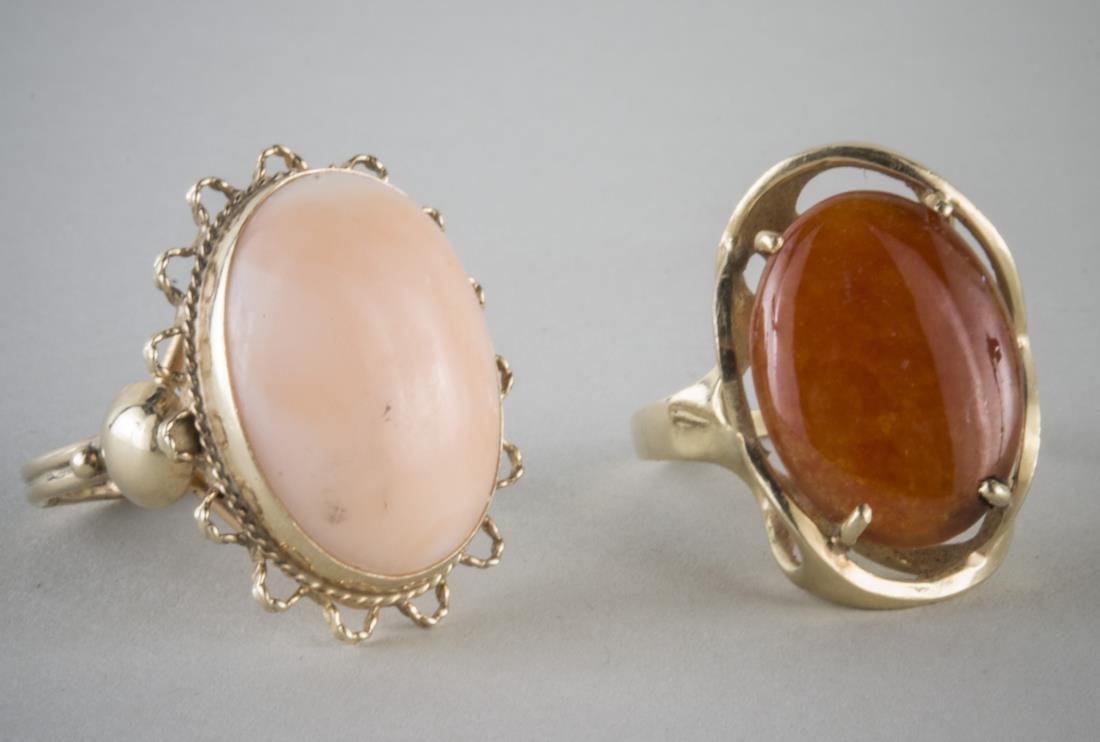 Two Gold Rings: Both 14k yellow gold, one with coral cabochon, size 9 and the other a carnelian cabochon, size 8 1/2.