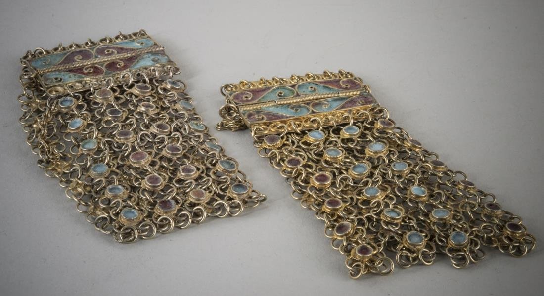 Pair of Enamel Decorated Chain Bracelets: Each with red and green enamel scroll decoration. Length 8 inches.