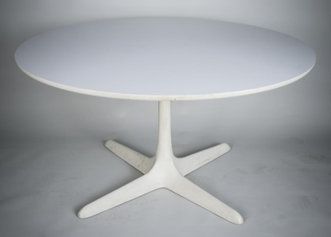 Burke / Knoll Table: Circular table with white laminate top on a fused white plastic star / propeller base. Height 29 inches, diameter 54 inches.