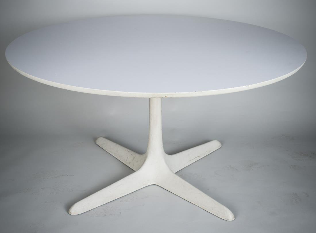 Burke / Knoll Table: Circular table with white laminate top on a fused white plastic star / propeller base, Knoll label. Height 29 inches, diameter 54 inches.
